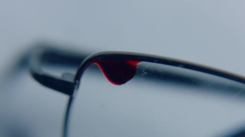 Drop of blood on a pair of glasses