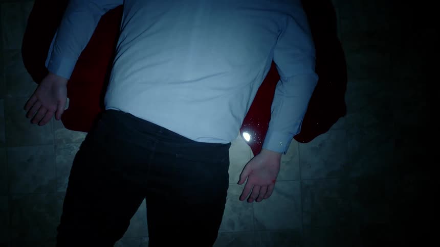 A man lying in a pool of blood