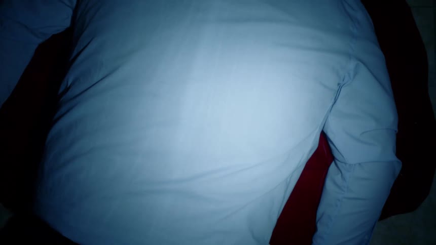 A man lying in a pool of blood