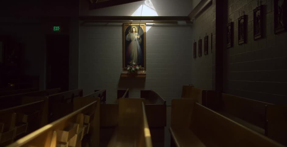 A painting and pews in a church