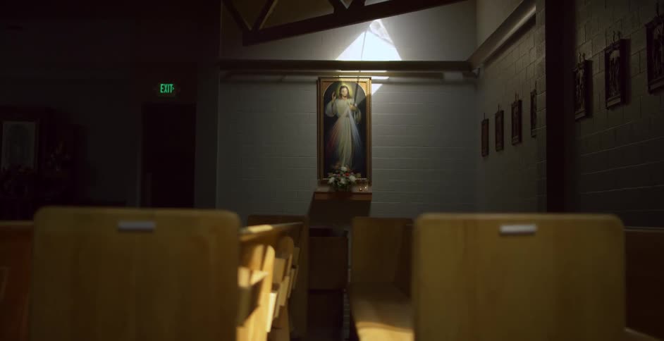 Pews and a painting in a church