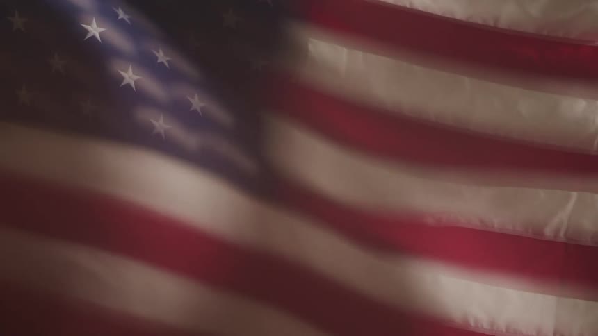 The american flag blowing in the wind