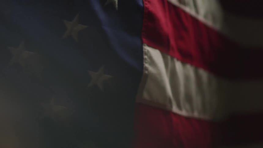 An american flag billowing in the wind