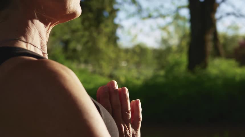 A woman doing yoga outside