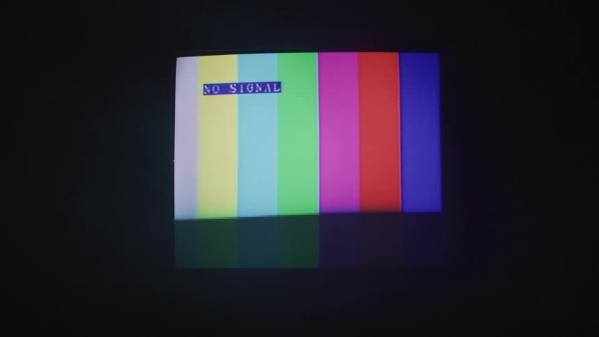 A rainbow screen and a no signal message flash on a crt tv