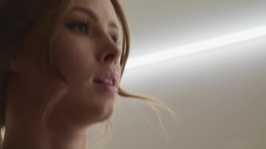 Woman runs indoors under fluorescent lights