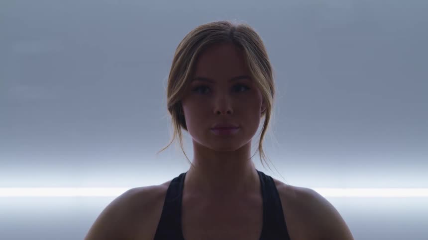 A woman is exercising and stretching