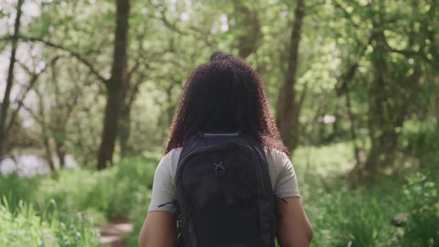 A woman hiking on a trail