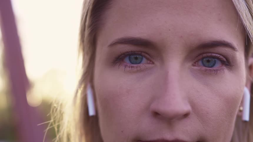 A female teenager with earbuds in