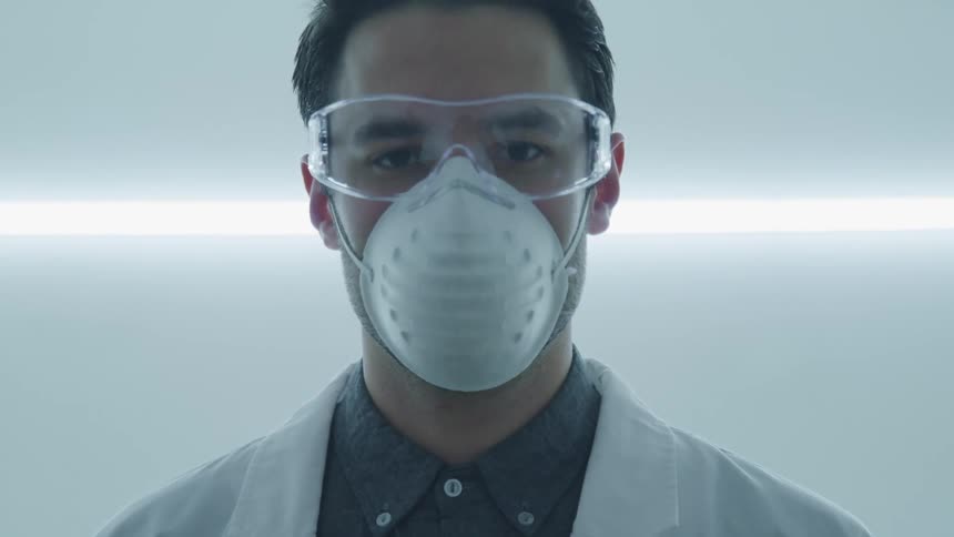 A doctor with goggles and a mask on