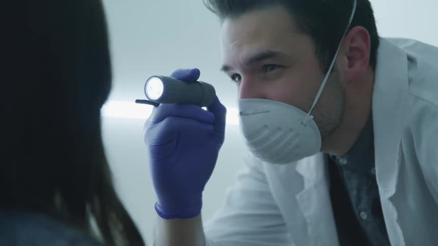 A doctor is examining a patient