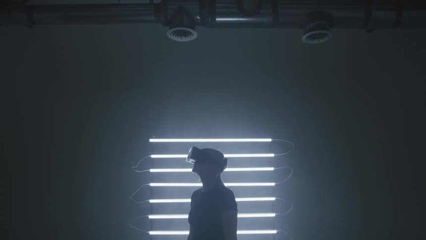 A woman with a virtual reality headset on