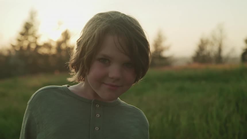 A child outside on a lawn
