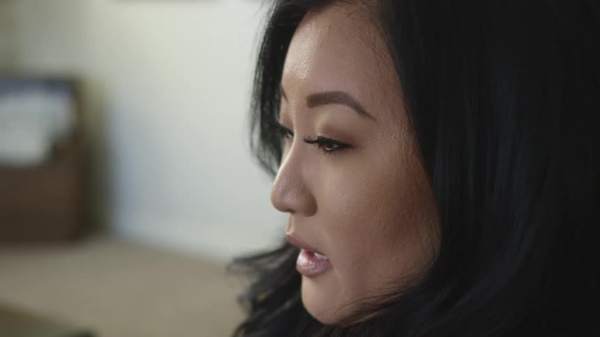 A woman is talking in a room