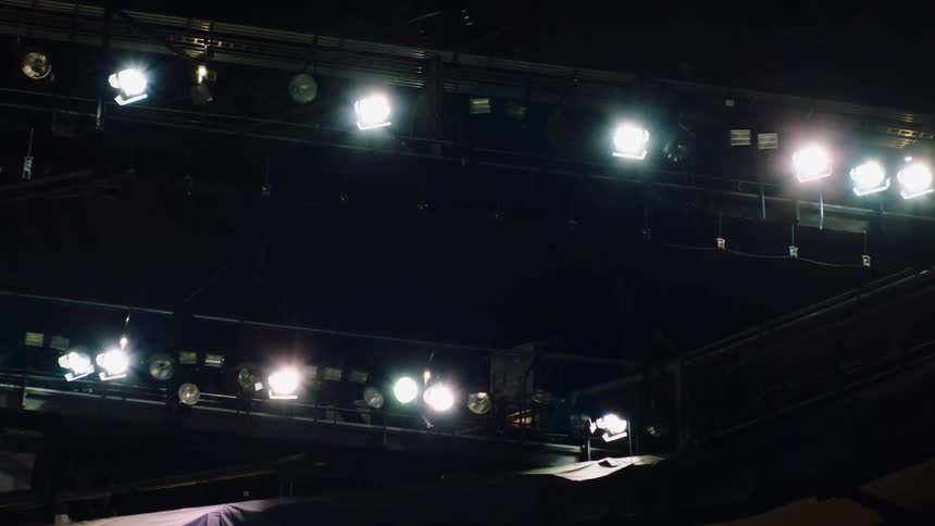 Lights lit up at a stadium