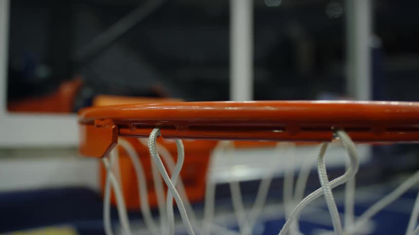 Close up of an orange metal basketball hoop