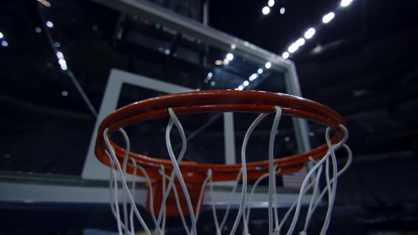Close up of metal orange hoop and hanging net