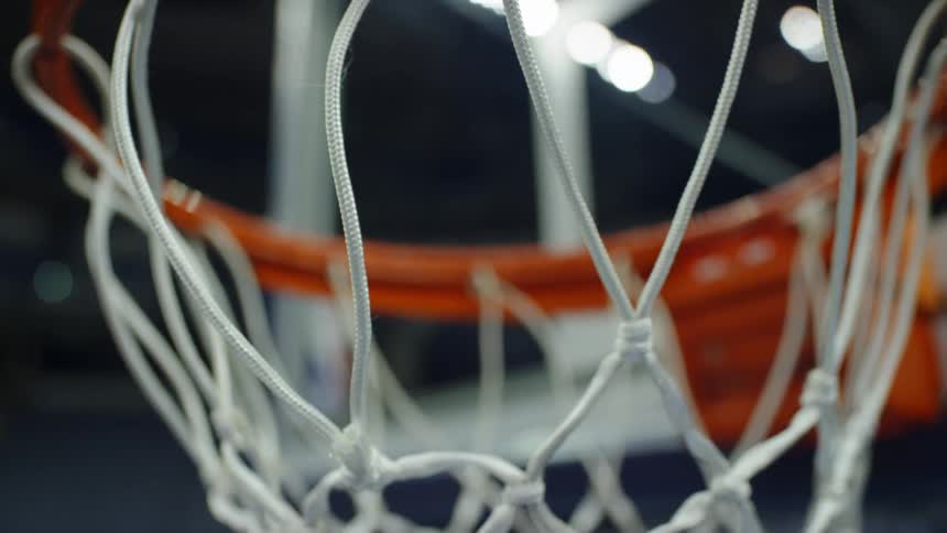 Close up of metal orange hoop and hanging net