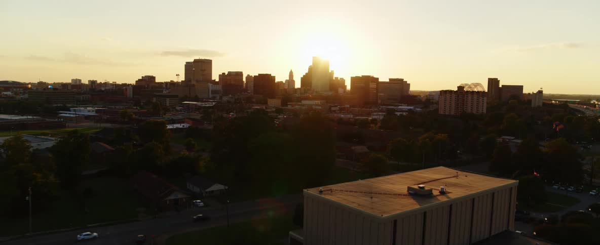 A city skyline and surrounding urban buildings at dawn