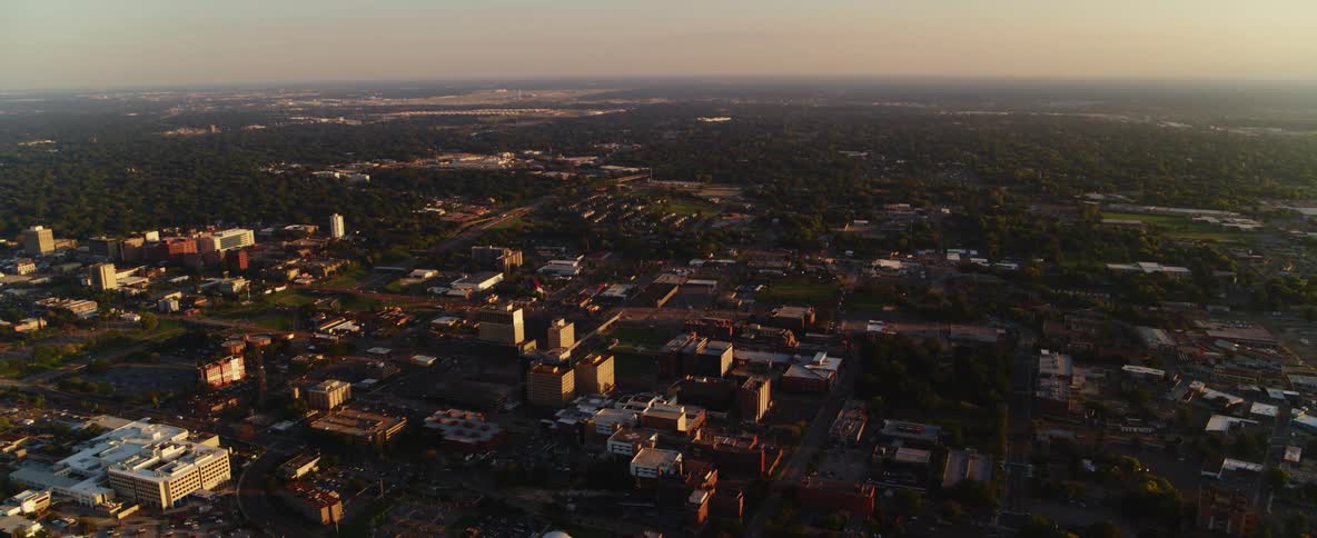 Buildings in a city sit at dusk