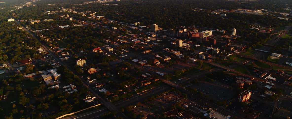 An aerial view of a downtown city is displayed
