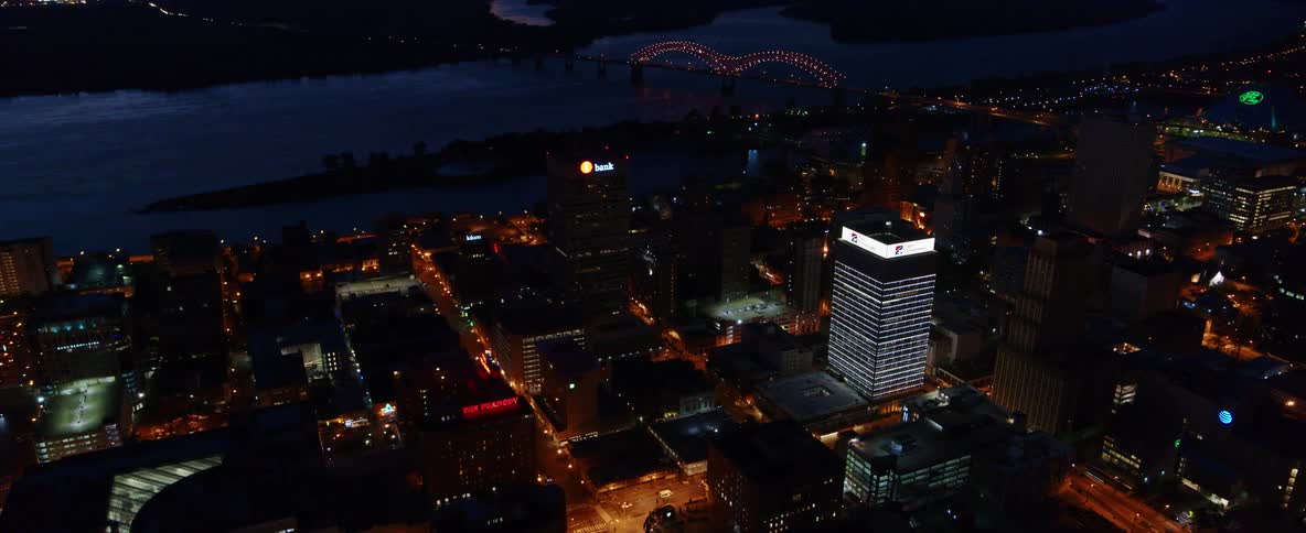 Aerial view of a waterfront city downtown at night