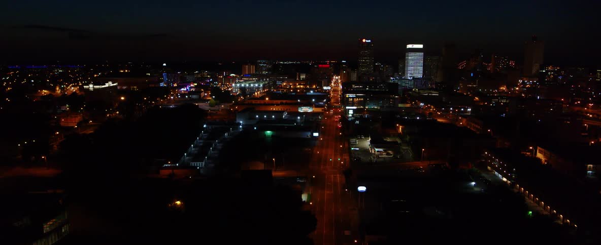 An aerial view of a downtown city is displayed