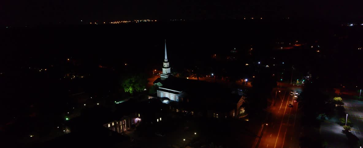 Cars travel on the roads in the city at night