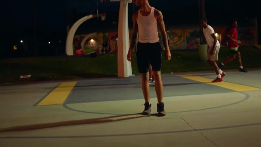 A group of teen boys on a basketball court