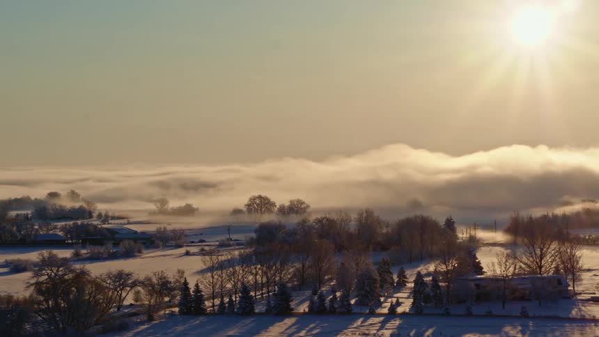 Aerial view of snow covered farmland