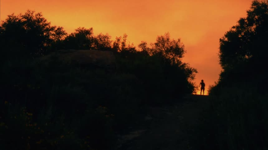 A person runs up the hill
