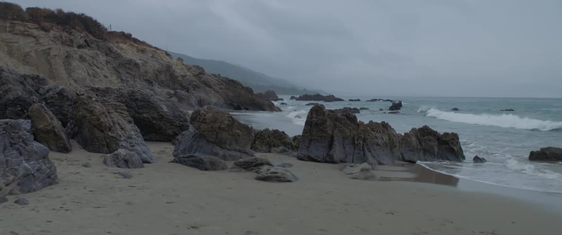 Water crashing to a rocky shore