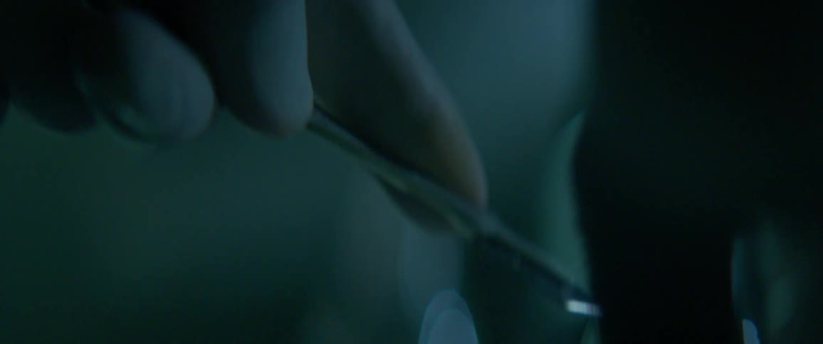 A person uses a scalpel