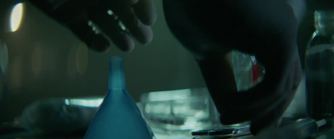 A doctor picks up a scalpel