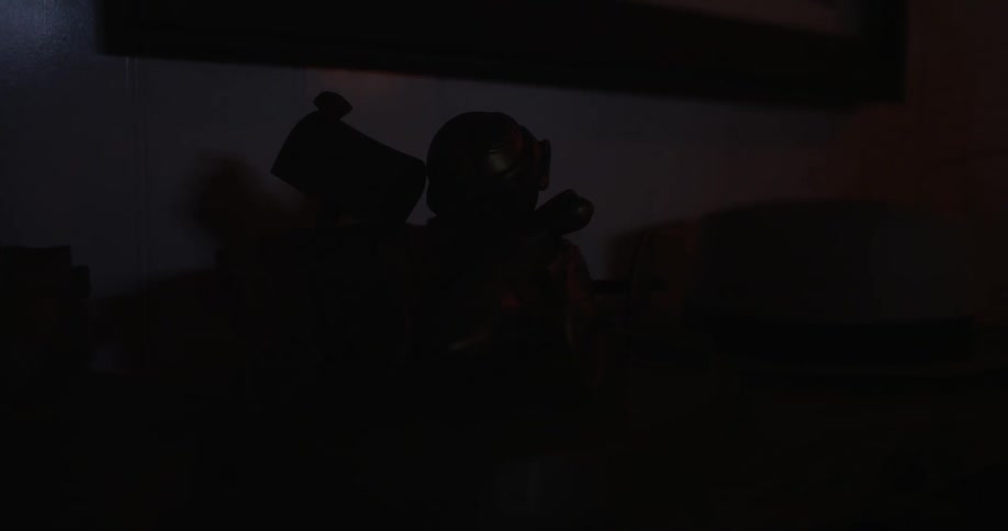 Some items sit on a desk in a dark room