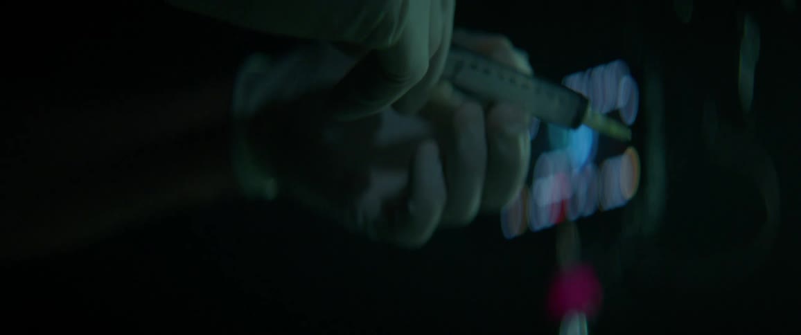 A person places a cap on a syringe