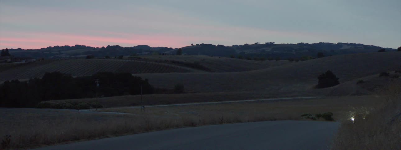 A truck driving in a rural area