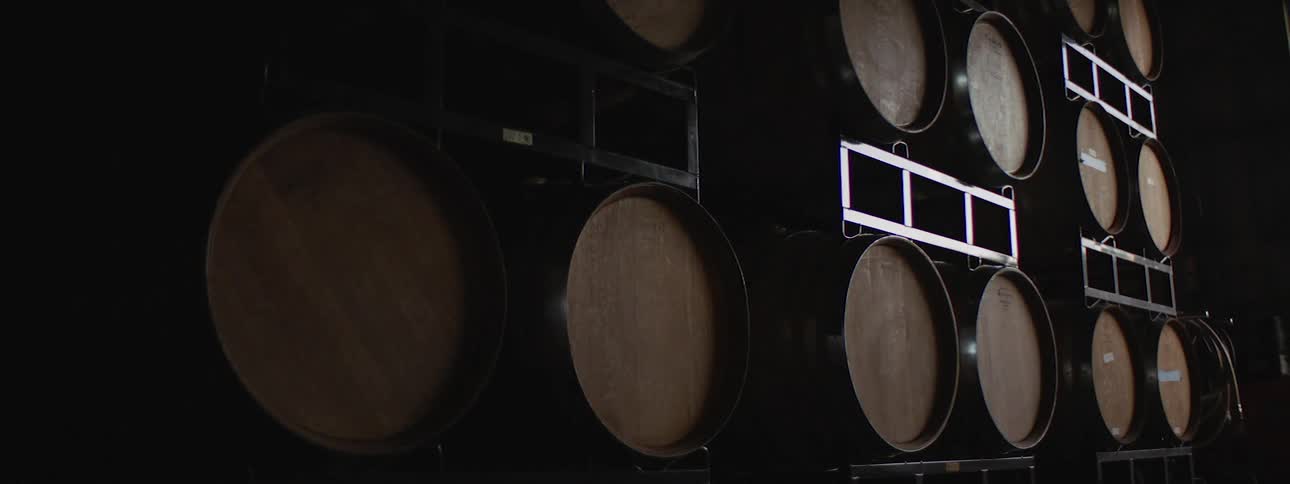 Barrels of wine stored in a factory
