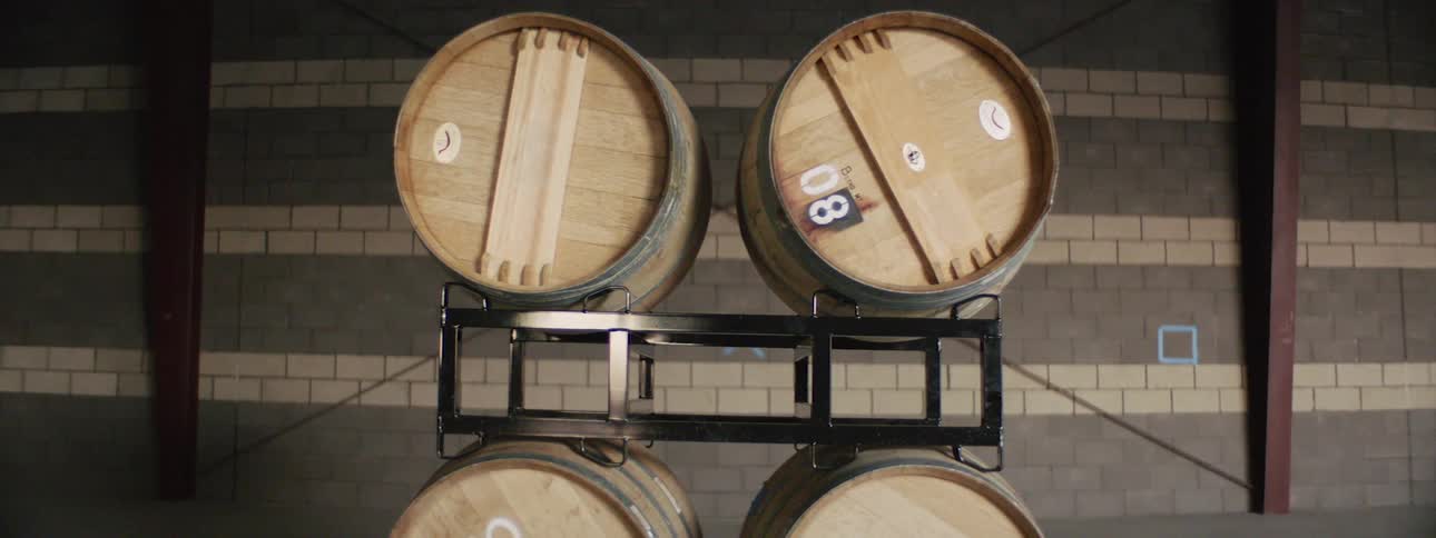 Barrels on a shelf in a distillery