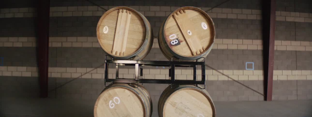 Barrels on a shelf in a distillery