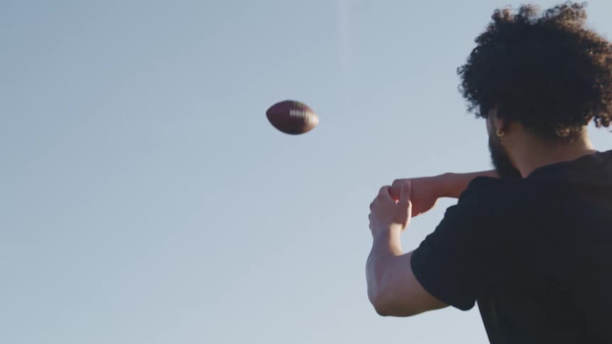 A man catches the football