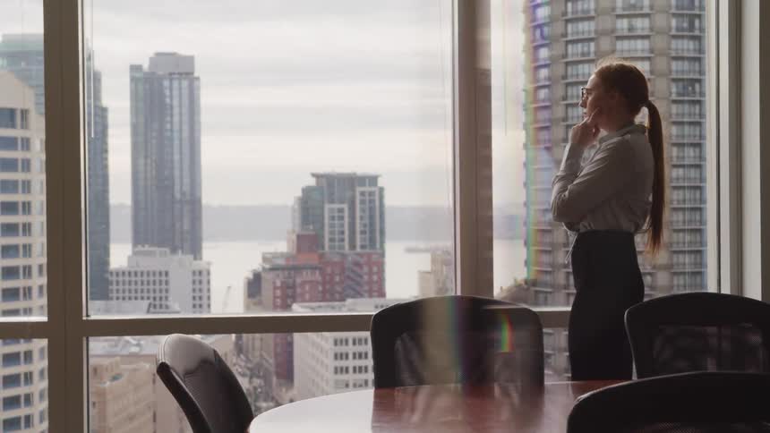 A woman talks on her cell phone in the conference room