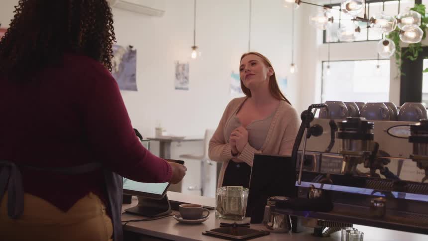 Woman ordering food inside a coffee shop