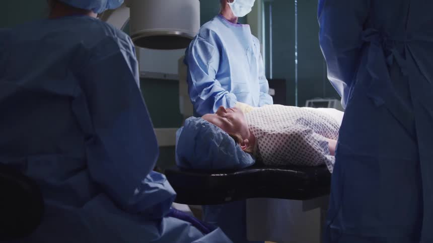Surgeon operating on a patient in a surgery room