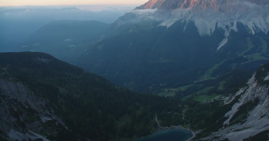 An aerial view of a mountain is displayed