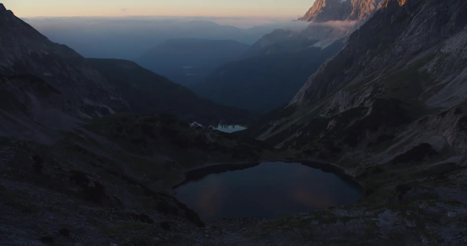 An aerial view of a mountain is displayed