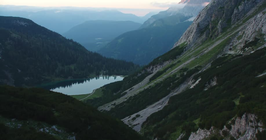 An aerial view of a mountain is displayed