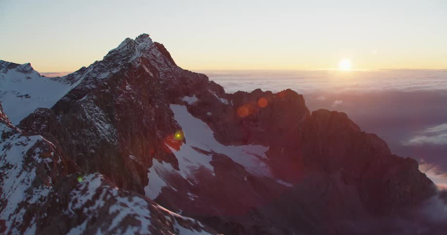 An aerial view of a snowy mountain range