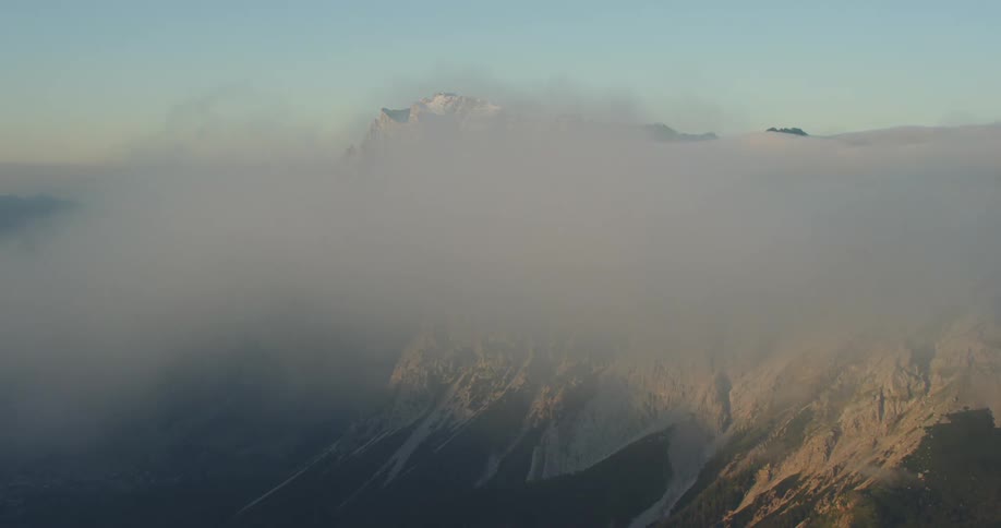An aerial view of a mountain is displayed