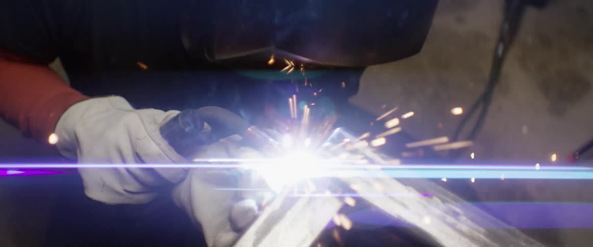A man is welding some metal